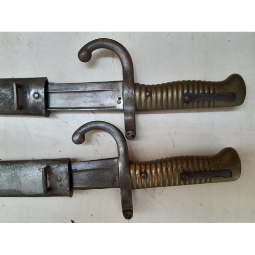 238 - Two French Chassepot bayonets with original scabbards, circa 1870, each having various inspectors an... 