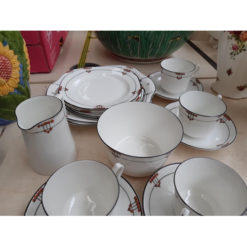 242 - An Art Deco 24 piece hand painted tea set comprising cake plate, tea cups, side plates etc.