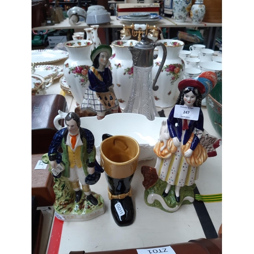 247 - Six items to include a pressed glass claret jug, three Staffordshire style figurines, a white cerami... 