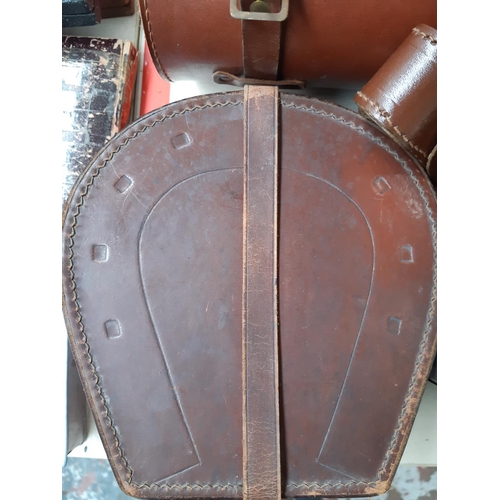 248 - Three items to include a brown leather horse shoe shaped gents collar box, brown leather cased set o... 