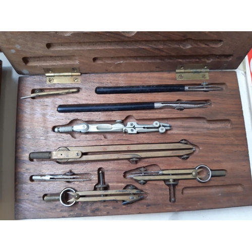 249 - A collection of mixed items to include two Rolls Razors (one boxed), an oak cased tie press, precisi... 