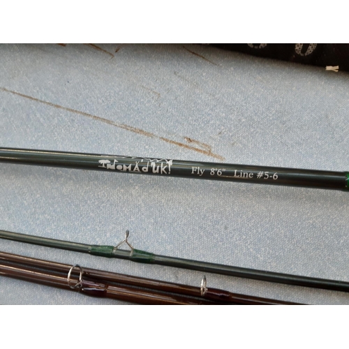Four various fishing rods to include a Fulling Mill world class