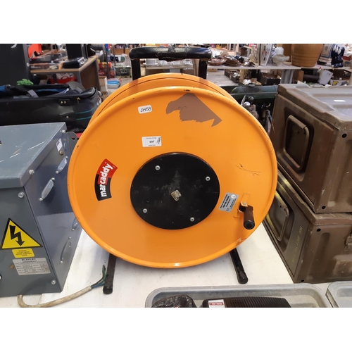 697 - A black and orange Marcaddy cable reel with coaxial cable