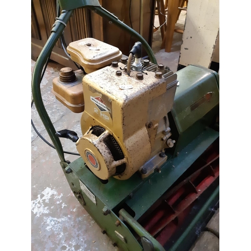 718 - A vintage green Webb AB 1476 petrol lawn mower with Briggs & Stratton 2HP engine