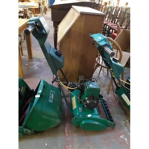 721 - A green Qualcast Suffolk Punch 35s petrol lawn mower