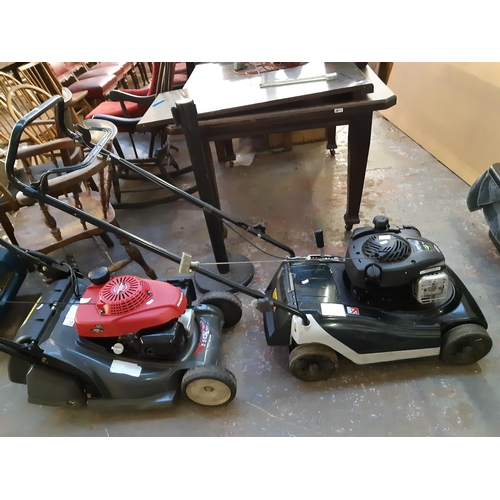 724 - A black and green Hayter Spirit 41 petrol lawn mower