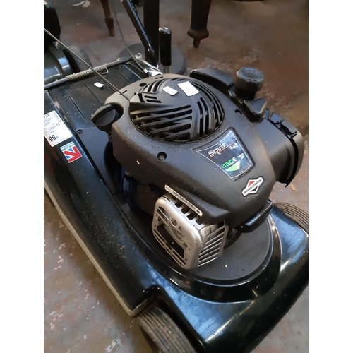 724 - A black and green Hayter Spirit 41 petrol lawn mower