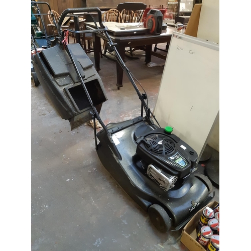 725 - A grey Hayter Harrier 48 Pro petrol lawn mower with non matching grass box