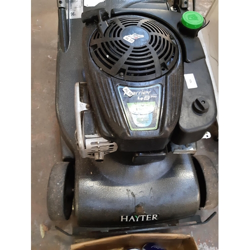 725 - A grey Hayter Harrier 48 Pro petrol lawn mower with non matching grass box