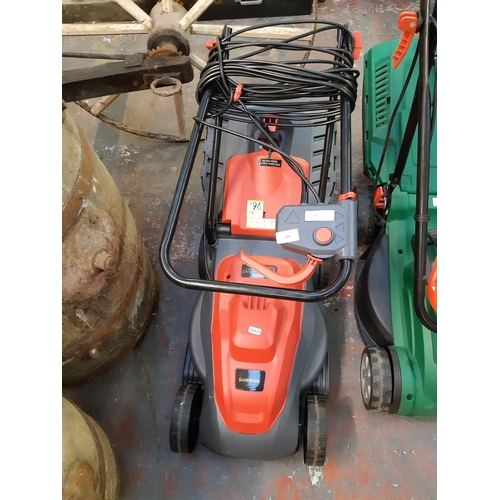 726 - A black and grey Sovereign IPX4 electric lawn mower with grass collector (Shop return)