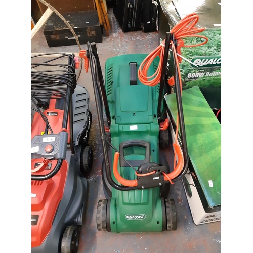 727 - A black and green Qualcast MEB1434M electric lawn mower with grass collector (Shop return)