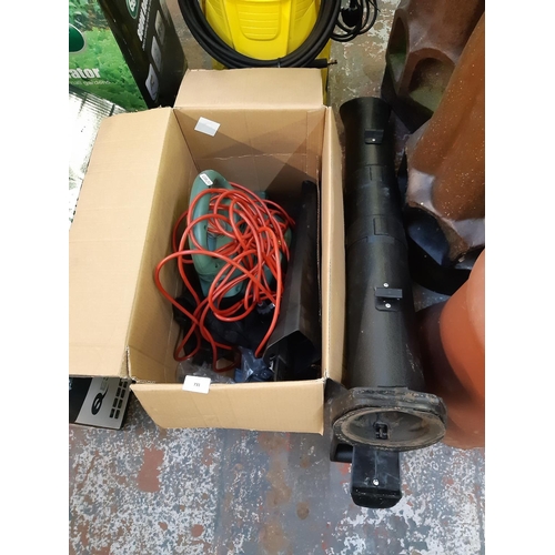 731 - A boxed Bosch electric universal garden tidy leaf blower/garden vac (Shop return)