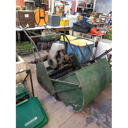 736 - A vintage green Atco petrol industrial roller lawn mower with grass collector