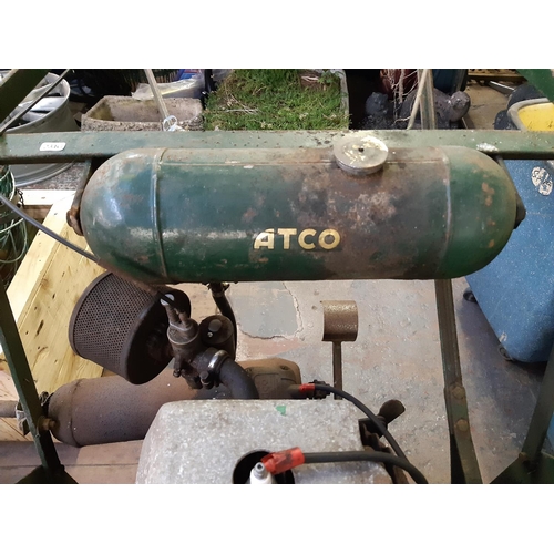 736 - A vintage green Atco petrol industrial roller lawn mower with grass collector