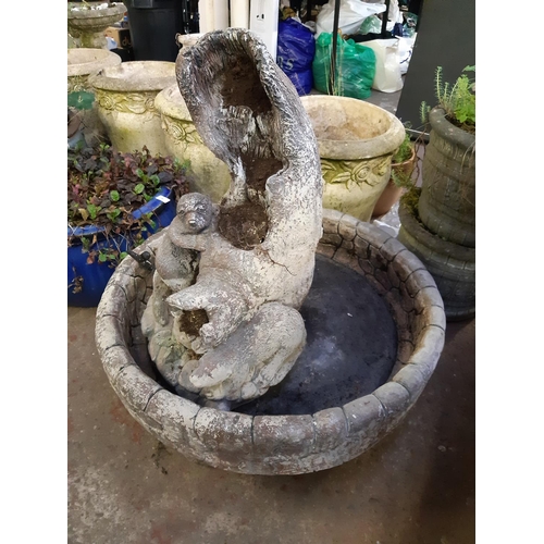 740 - A large cast stone otter water feature - measuring approx. 32