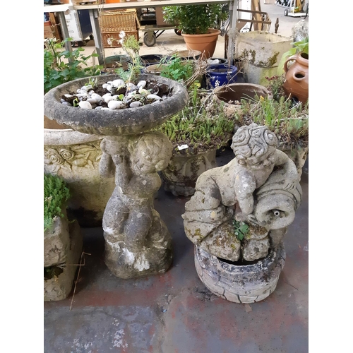 747 - Two cast stone cherub water features - one measuring approx. 2' tall and the other 22