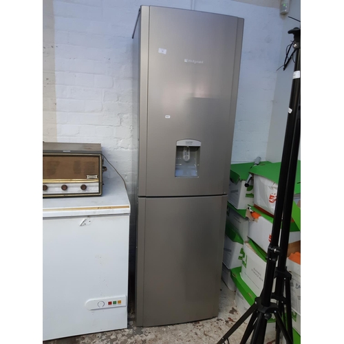 756 - A large grey Hotpoint upright fridge freezer with water dispenser - measuring approx. 6' in height