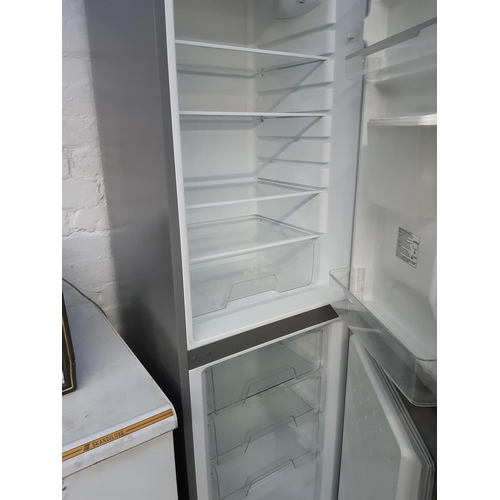 756 - A large grey Hotpoint upright fridge freezer with water dispenser - measuring approx. 6' in height