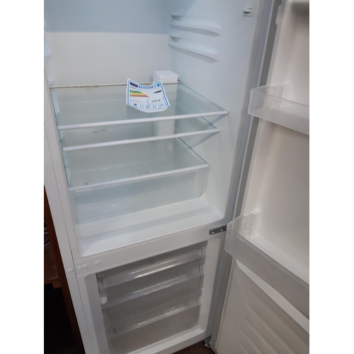 763 - A white upright fridge freezer - measuring approx. 143cm tall