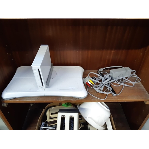 765 - A Nintendo Wii games console with leads and balance board