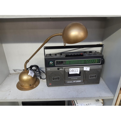 781 - Two items to include a vintage Sharp GF-1880 portable radio cassette player and a vintage gold paint... 