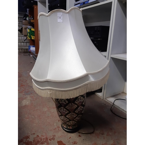 784 - A large decorative porcelain table lamp and shade