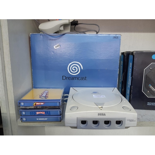 786A - A boxed Sega Dreamcast games console with control pad and a selection of games to include Crazy Taxi... 