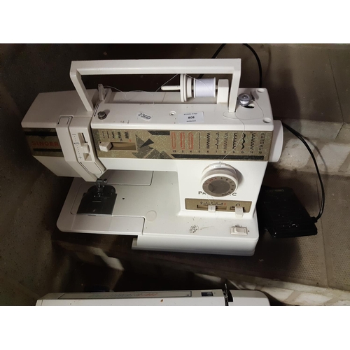 808 - A Singer Panoramic electric sewing machine with foot pedal