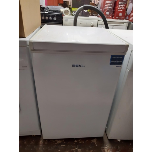 819 - A Beko top loading 55cm chest freezer