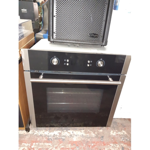 827 - A black integrated electric fan oven