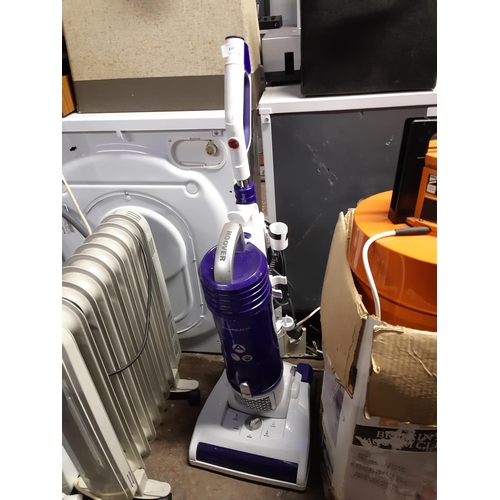 838 - A purple and white Hoover upright bagless vacuum cleaner