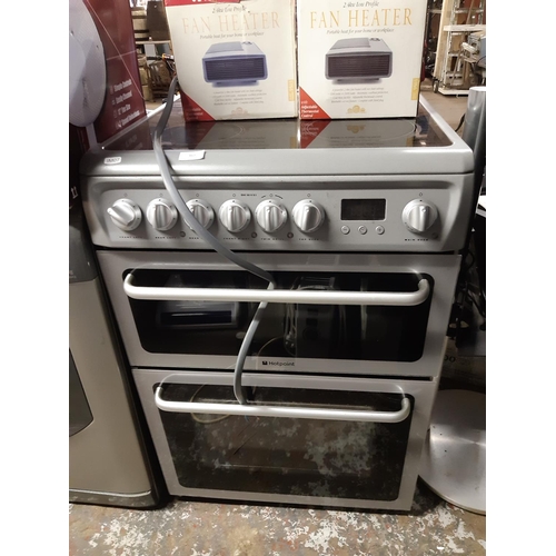 862 - A black and grey Hotpoint 60cm electric cooker with double fan oven