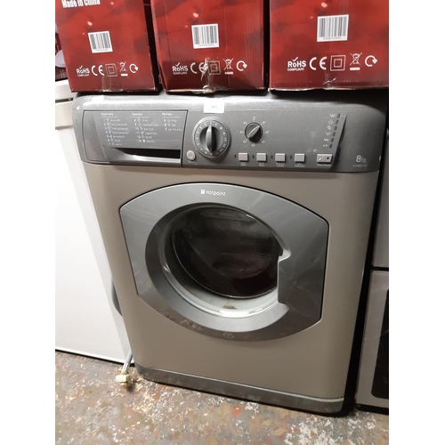 864 - A grey Hotpoint HV8B593 8 kg kilo washing machine