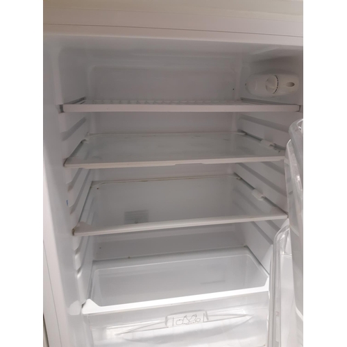 866 - An Indesit A+ class under counter fridge