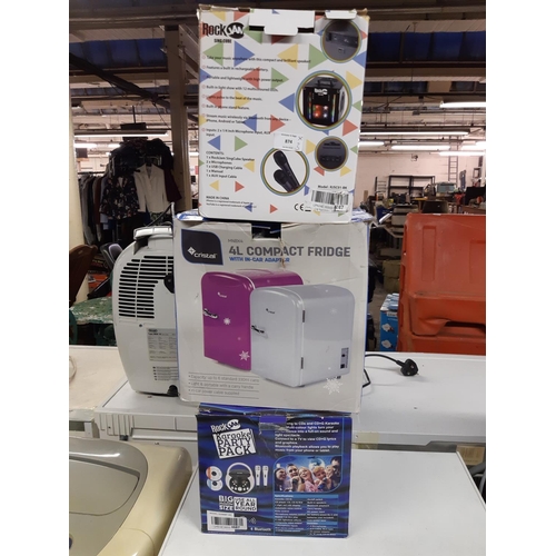 874 - Three boxed items to include Rock Jam sing cube, Cristal 4 litre compact fridge with in car adapter ... 