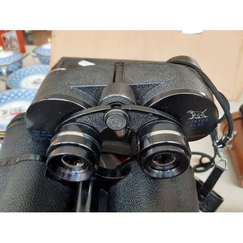 206 - Four pairs of vintage cased binoculars to include a pair of Hunter model 711 8x30, Titan 10 X 50, El... 