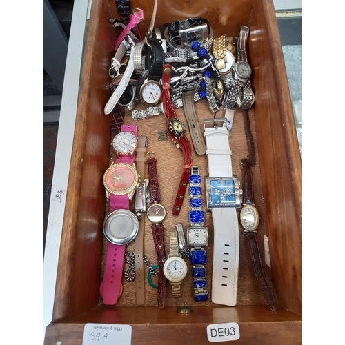 59A - A box containing a large quantity of various ladies wrist watches to include Berge, Badavici etc.