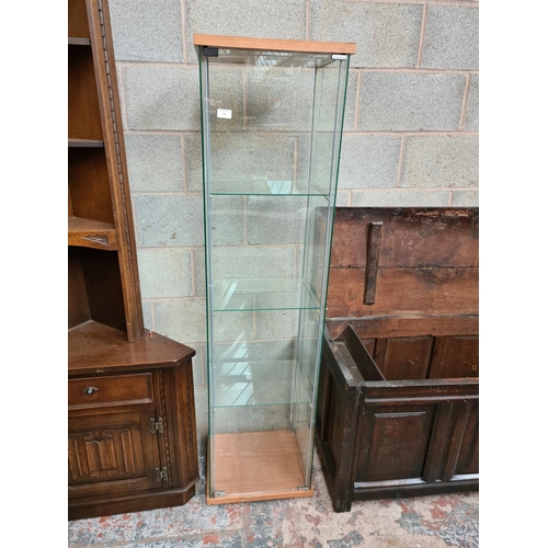 493 - A modern Ikea glass display cabinet with three internal shelves