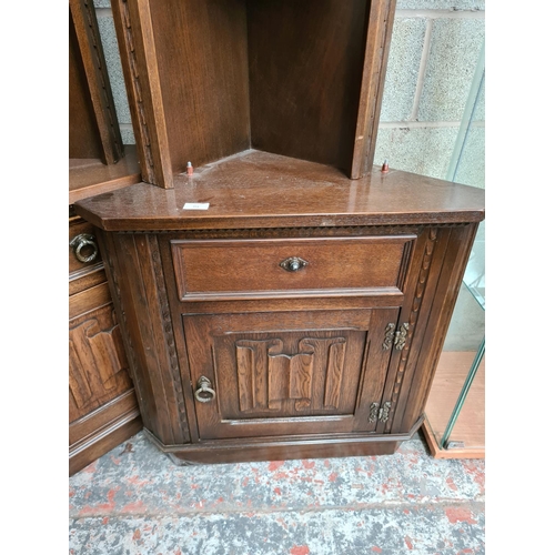 494 - A pair of Jaycee oak freestanding corner cabinets (see condition report)