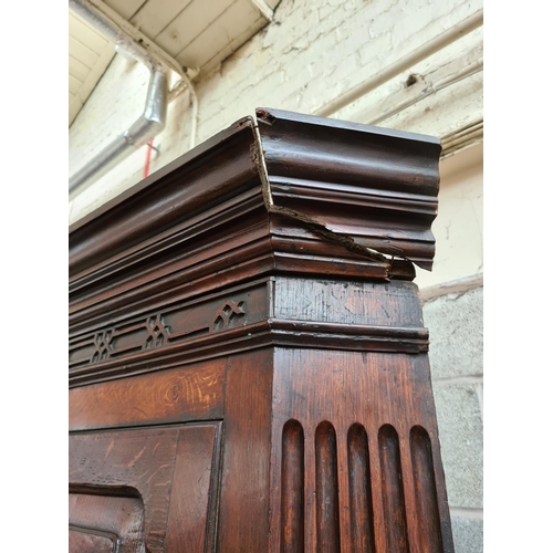 497 - A George III oak flat front corner cabinet with two upper doors, three internal shelves, two lower d... 