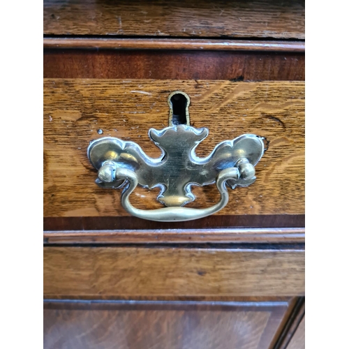 498 - A George III oak welsh dresser with upper plate rack, three upper drawers, two cupboard doors and th... 