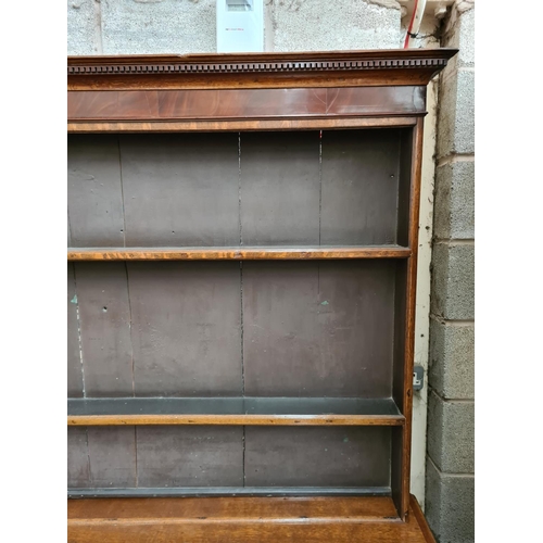 498 - A George III oak welsh dresser with upper plate rack, three upper drawers, two cupboard doors and th... 