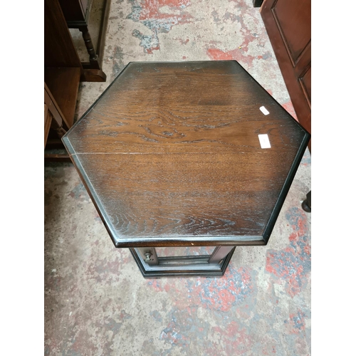 514 - A Luptons oak hexagonal display cabinet/table - measuring approx. 58cm high and 60cm wide