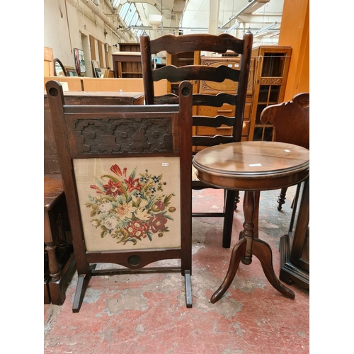 515 - A mahogany tripod wine table with circular top and an oak framed fire screen with tapestry centre