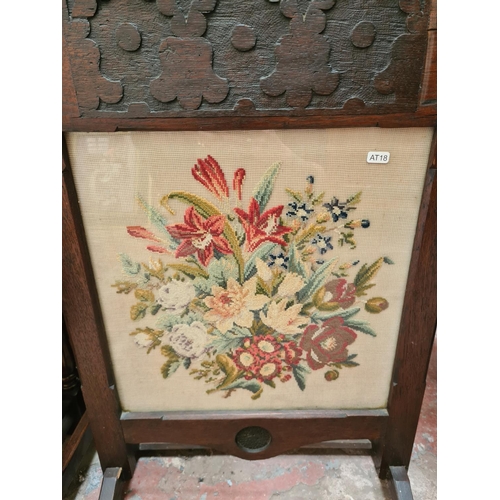 515 - A mahogany tripod wine table with circular top and an oak framed fire screen with tapestry centre