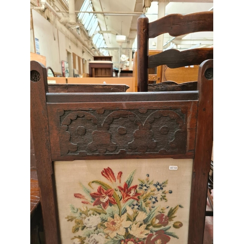 515 - A mahogany tripod wine table with circular top and an oak framed fire screen with tapestry centre