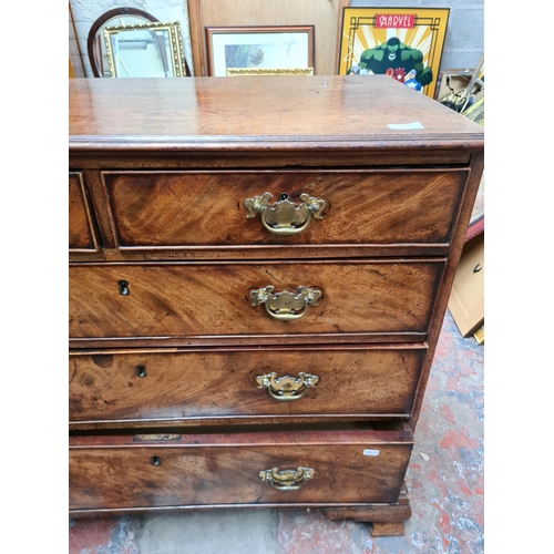 517 - A George III mahogany chest of two short over three long drawers on ogee bracket supports - measurin... 