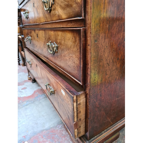 517 - A George III mahogany chest of two short over three long drawers on ogee bracket supports - measurin... 