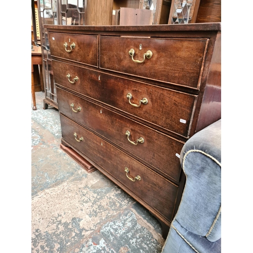 525 - A George III mahogany chest of two short over three long drawers with brass swan neck handles and br... 