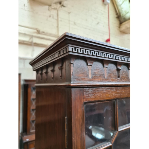 526 - An early 20th century mahogany display cabinet with two glazed doors - measuring approx. 189cm high,... 